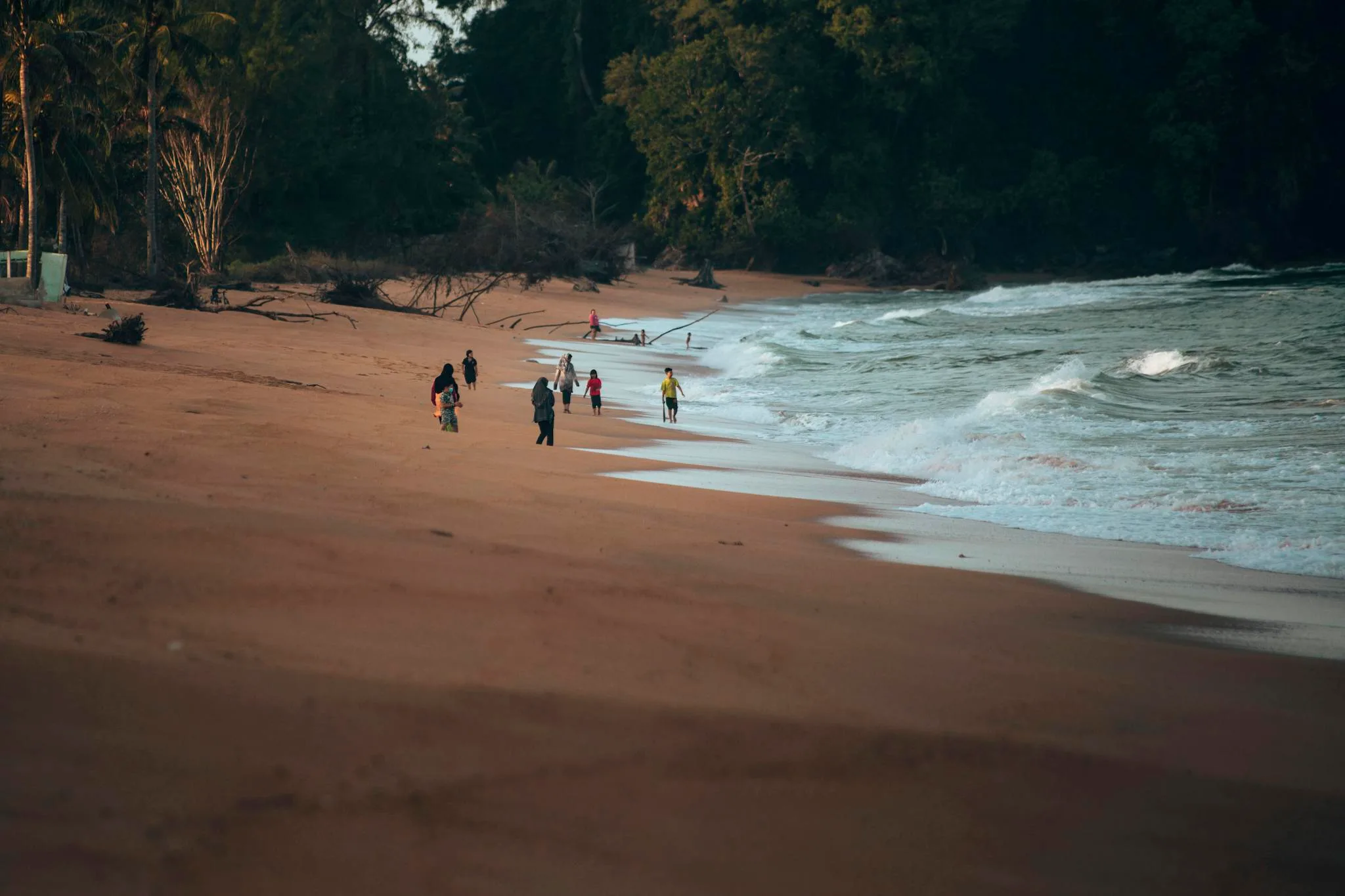 anonymous people strolling on sandy seashore near 1